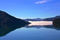 Rolling fog line in Nydia Bay Marlborough NZ 