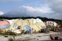 Ruins of Gullivers Kingdom Amusement Park in Japan with Mount Fuji in the distance 
