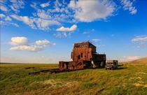 Rusting shipwreck on the dried up aral sea Photo by Denis Frantsouzov
