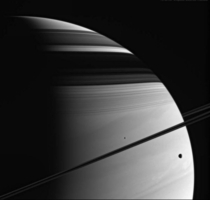 Saturn and its two moons -- Tethys and Mimas