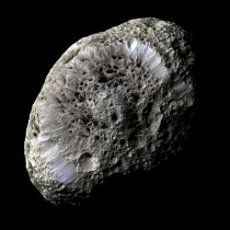 Saturns moon Hyperion A Moon with Odd Craters -- The sponge-textured moon has a density so low that it might house a vast system of caverns inside 