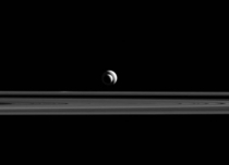 Saturns moons Enceladus and Tethys line up almost perfectly for Cassinis cameras