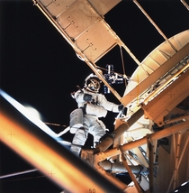 Scientist-astronaut Owen K Garriott Skylab  science pilot is seen performing an EVA at the Apollo Telescope Mount ATM of the Skylab space station cluster in Earth orbit photographed with a hand- held mm Hasselblad camera 