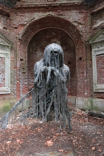Sculpture of a demon in an abandoned mausoleum in Jelenia Gra in Poland CT 