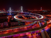 Shanghais Nanpu Bridge is covered in a rainbow light-show as it welcomes in  