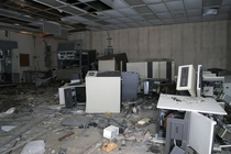 Smashed mainframes in an abandoned factory 