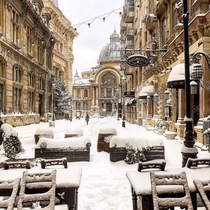 Snow covered street leading up to the CEC Bank headquarters Bucharest Romania