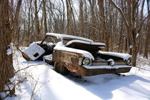 Snowy Abandoned car in woods near Chicago IL 