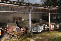 Some of a collection of abandoned cars found in a barn in Western France 