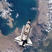 Space Shuttle Atlantis is seen from the Mir- crew members aboard Russias Mir Space Station June 