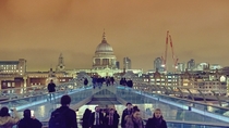 St Pauls Cathedral at night time as seen from Millennium Bridge - London UK 
