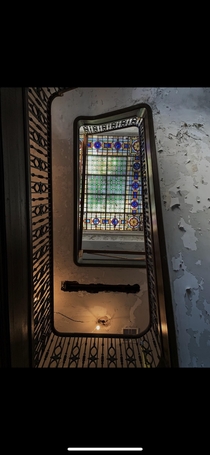 Stained glass above a stairwell in an Abandoned Mansion