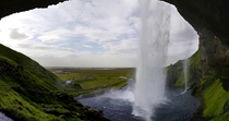 Standing behind the Selandjafoss waterfall in Iceland 