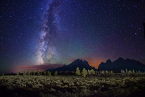 Starry night over Grand Teton Range Jenny Lake Wyoming  by Royce Bair