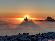 Steam rising from Lake Superior around Canal Park Lighthouse Duluth MN  Photo by geisslereliz