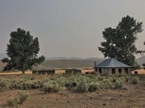 Stone ranch house and outbuildings in Eastern Oregon