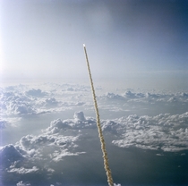 STS- on its way through the clouds with the first American woman ever in space aboard   x 