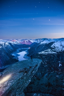 Stunningly beautiful view of Trolltunga at night  Odda Hordaland  Norway 