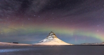 Such amazing timing on this shot A lucky capture of one of the Geminid meteors along with a colorful Aurora display - Kirkjufell Iceland  Photo by Kevin Gorton