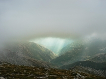 Sun rays breaking through clouds during GR hike on Corsica France 