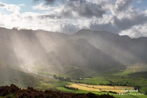 Sun rays cutting through the rain in the Langdale Valley The Lake District 