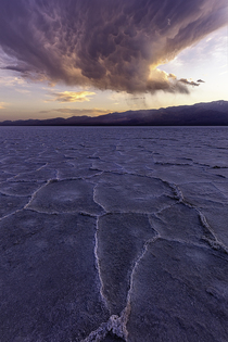 Sunburst through a raincloud in Death Valley 