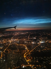 Sunrise  above Manchester UK at midnight from a plane