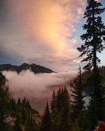 Sunrise between the clouds Alpine Lakes Wilderness Washington 