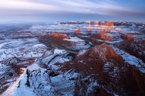 Sunrise in a snow covered desert Dead Horse Point in Utah  by danielbenjaminphoto