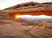 Sunrise through Mesa Arch in Canyonlands Moab UT - Cliche location Probably Worth seeing Hell yes Id like to thank this subreddit for inspiring me to get out of the house 