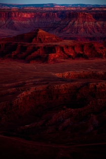 Sunset lights up the cliffs down in Dead Horse Point State Park Moab UT 