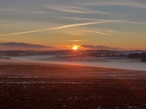 Sunset over the misty Berkshire downs Just a little bit of snow left 