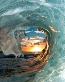 Sunset seen through a wave