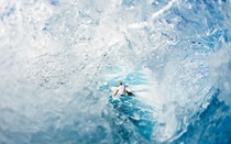 Surfer through a wave 