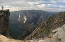 Taft Point Yosemite California with the sunlit cliffs of El Capitan in the distance 
