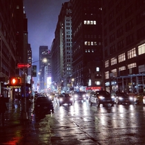 th Ave at Wth St Manhattan on a rainy night OC