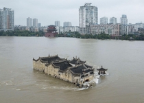 th-century Guanyinge Temple surrounded by flood waters of the Yangtze River last week