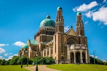 The Art Deco National Basilica of the Sacred Heart a Roman Catholic Minor Basilica and parish church is situated in Brussels Belgium The first stone of the basilica was laid in  but was halted by the two World Wars and finished only in 