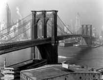 The Brooklyn Bridge arches toward Lower Manhattan  by Andreas Feininger 