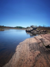 The Canadian Shield covers a large area of Canada and consist of exposed Precambrian rock This particular area shows signs from the last ice age the scars on the rock indicating the direction the glacier was moving in Frontenac County Ontario  OC