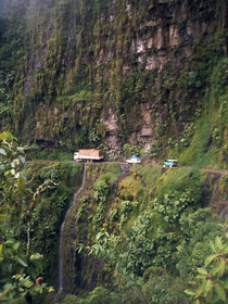 The cliff-hanging Yungas Road at San Pedro waterfall between La Paz and Coroico Bolivia 