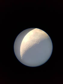The craters on the moon as viewed on my phone through a telescope