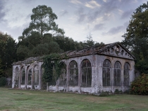 The crumbling remains of a stone orangery Found in the grounds of a magnificent castle Photo by memmett 