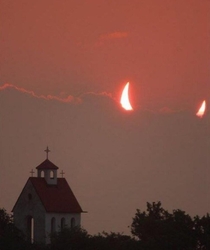 The Devils Eclipse right above a church