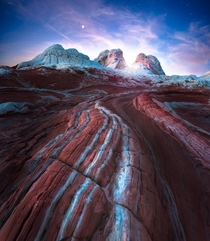 The Dragons Tail rock formation mangled in the otherworldly area of White Pocket Arizona during twilight 