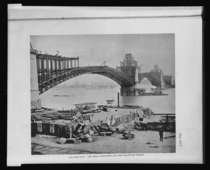 The erection of the Eads Bridge spanning the Mississippi St Louis Missouri the ribs completed and the roadways begun  