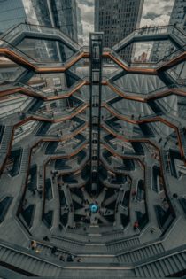 The extraordinary centerpiece of New Yorks Hudson Yards is its spiral staircase Comprised of  intricately interconnecting flights of stairs a soaring new landmark meant to be climbed This interactive artwork was imagined by Thomas Heatherwick and Heatherw