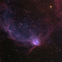 The Flying Lizard Nebula with young star cluster NGC  at its center 