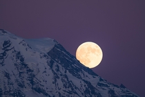 The full moon rising under Point Success on Mount Rainier  GarrettBaespflug