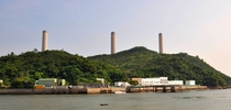 The giant chimneys of Lamma Power Station towering over idyllic Lamma Island Hong Kong 